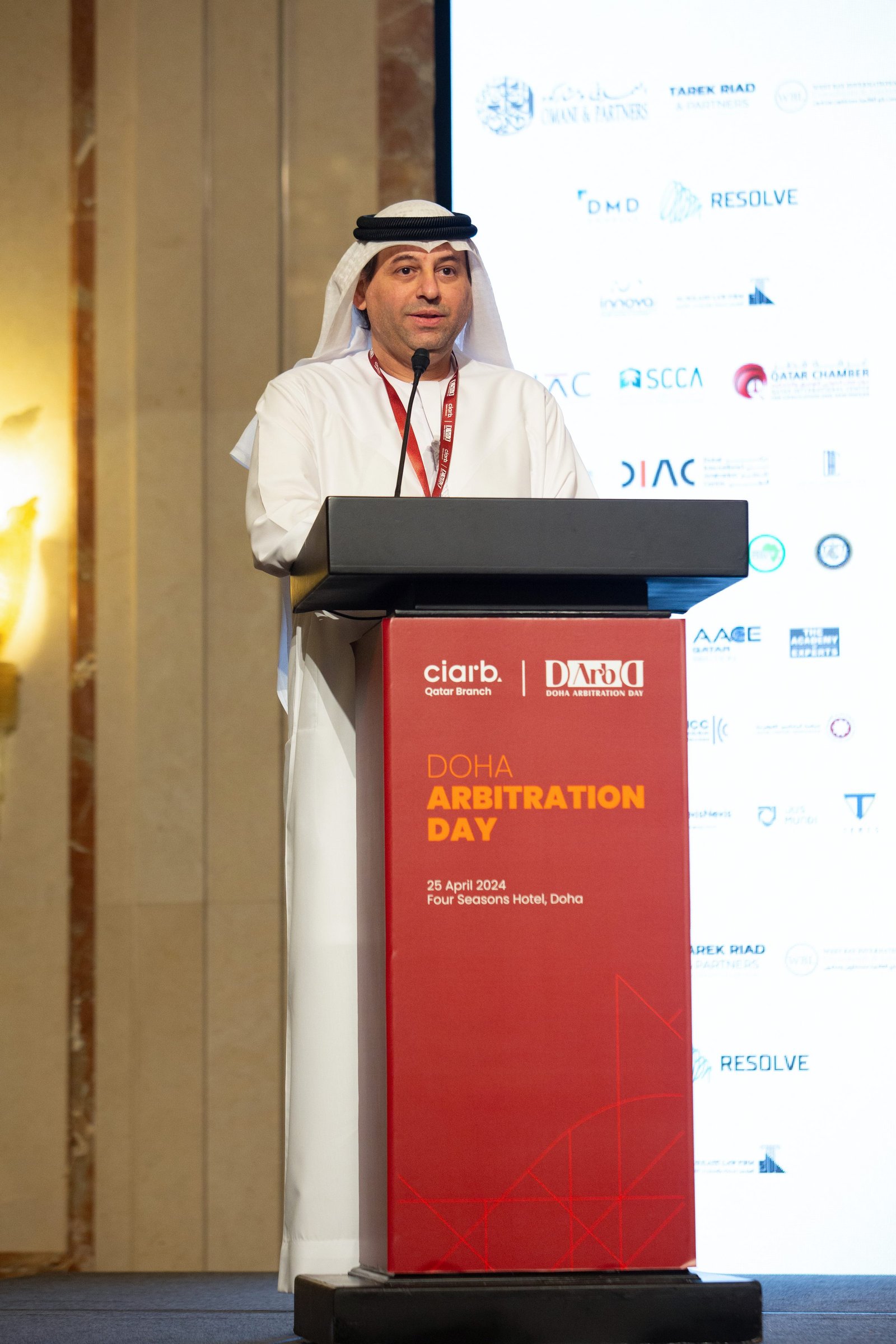 Speaker at the podium at the 1st Doha Arbitration Day