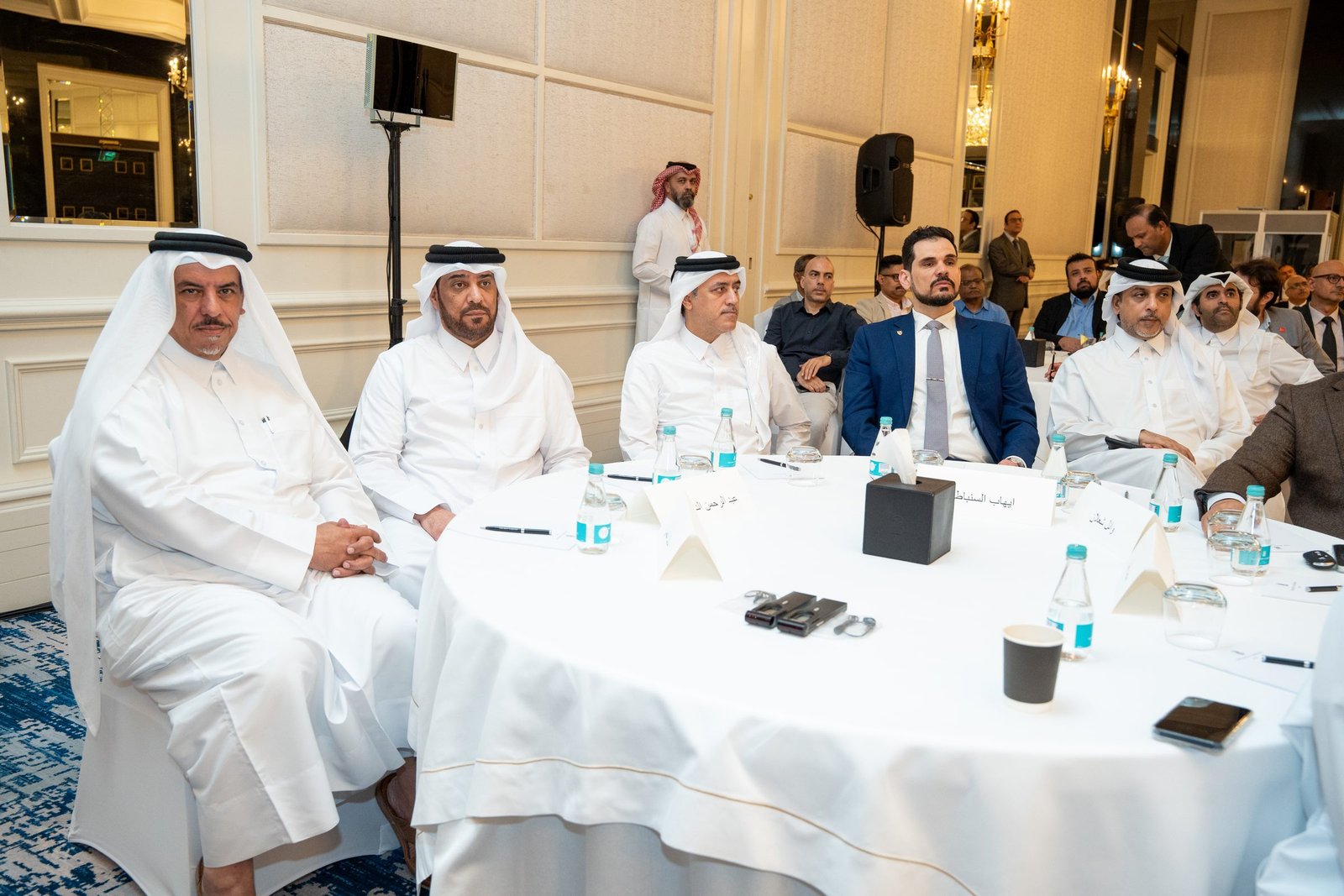 Delegates at a conference table at the 2nd Doha Arbitration Day